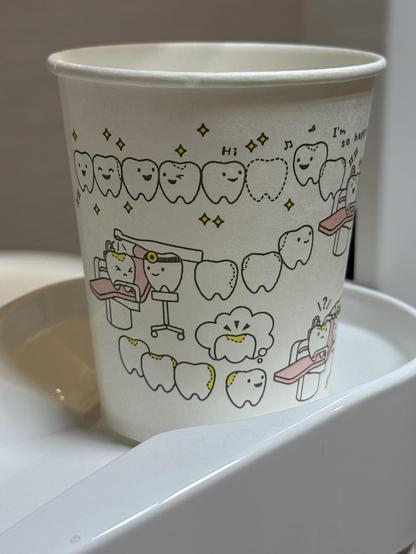 Gargling cup with a cute design of friendly smiling teeth at a dental clinic in the Itabashi Ward of Tokyo, Japan